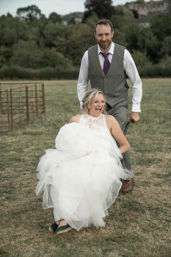 Bride and grome in Wheelbarrow in Herefordshire