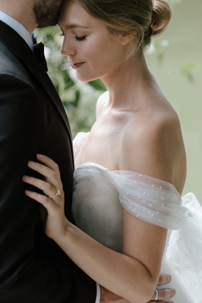 Closeup of wedding makeup on bride, eyes closed, smokey eye